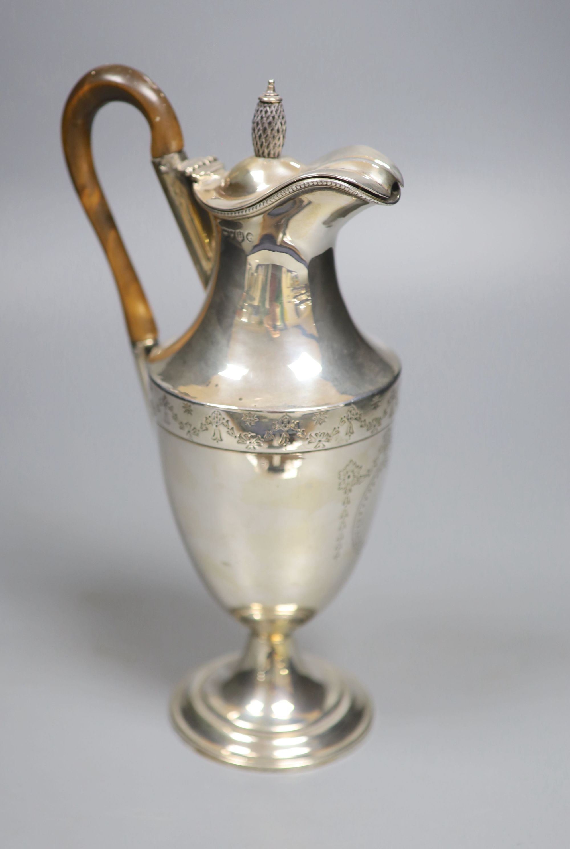 A late Victorian silver hot water pot, London, 1883, makers mark rubbed, height 26.1cm, gross 12.5oz.